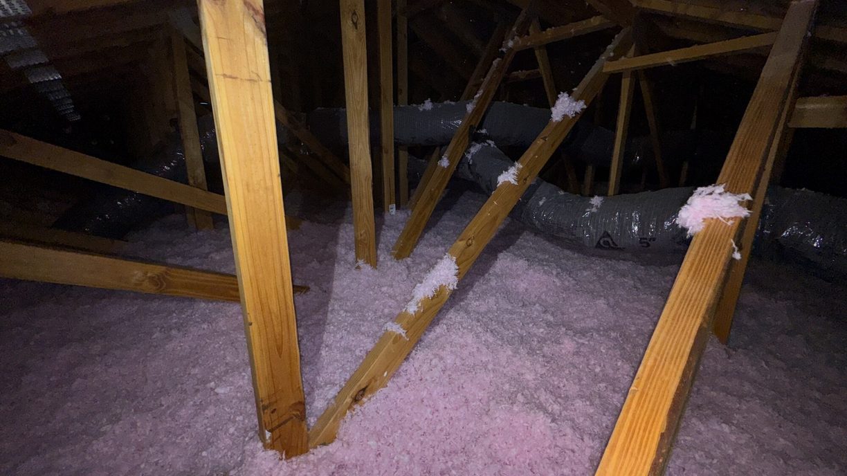 Blown-in attic insulation over ductwork in a Marble Falls, TX attic