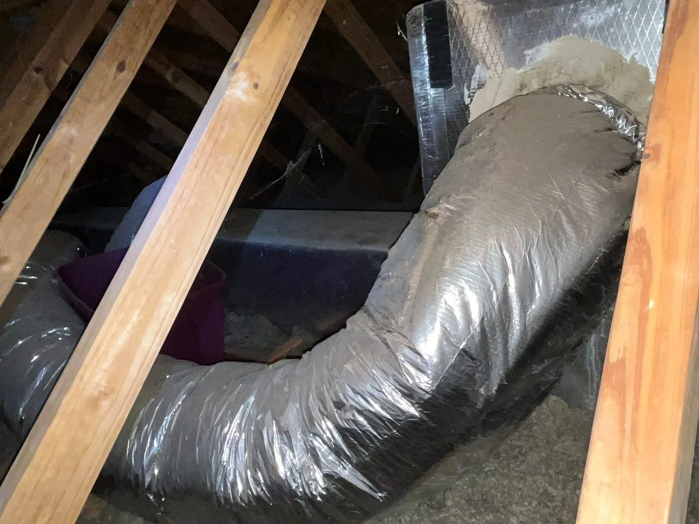 Flex duct pinched between the rafters in the attic