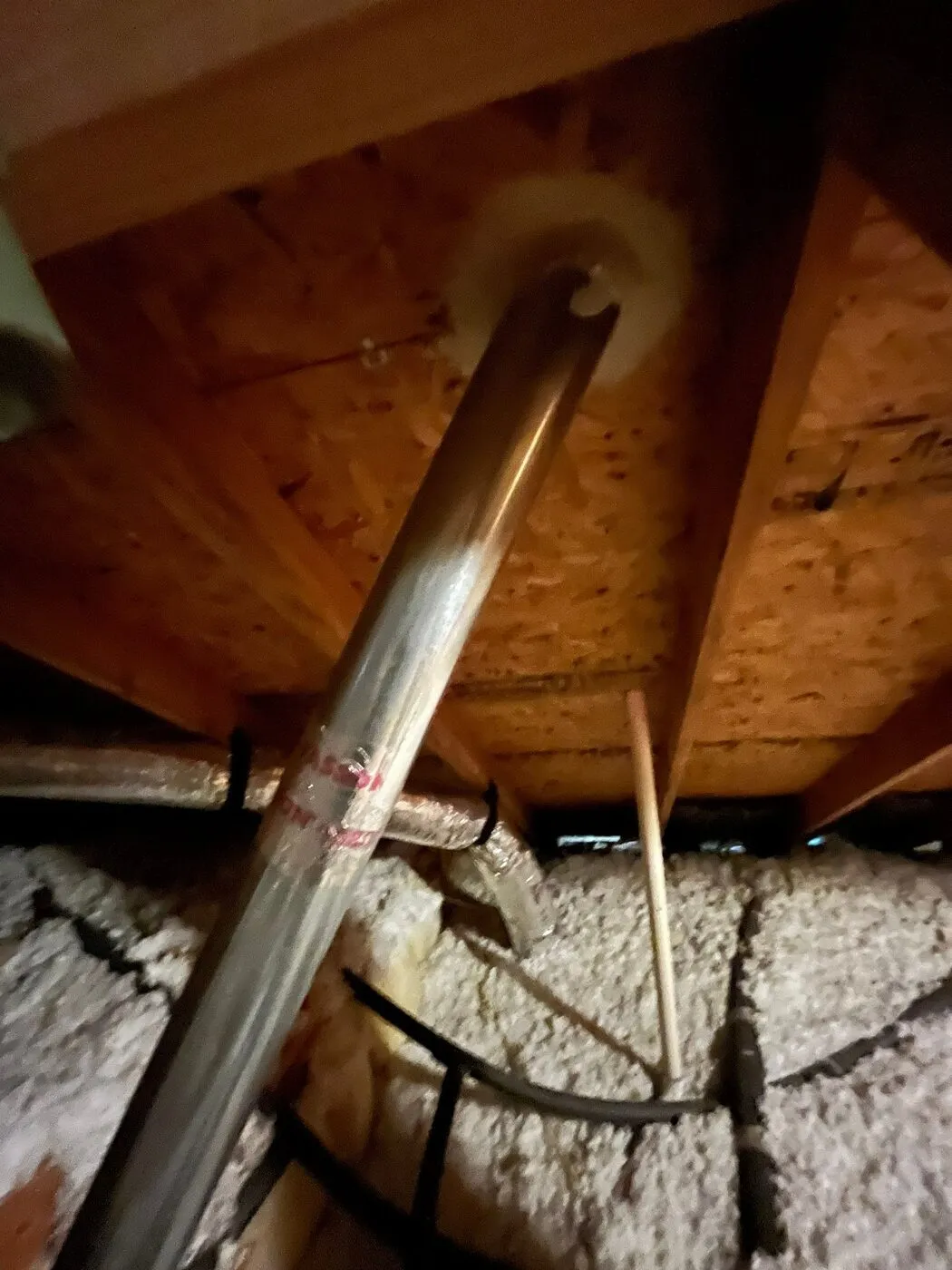 Penetration through the top plate into the attic, one of the air paths we check