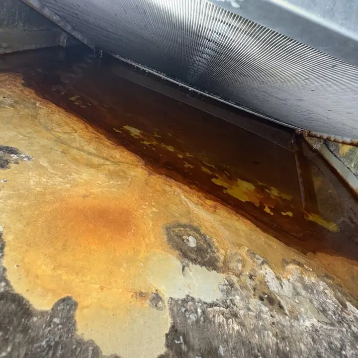 Rusty water in the drain pan, Central Texas
