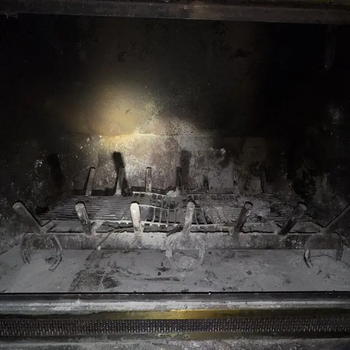 Firebox with logs before cleaning, Central Texas