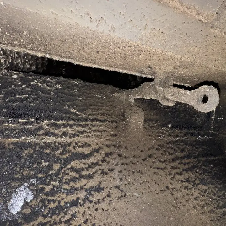 Dirt inside a duct next to the brush, Central Texas
