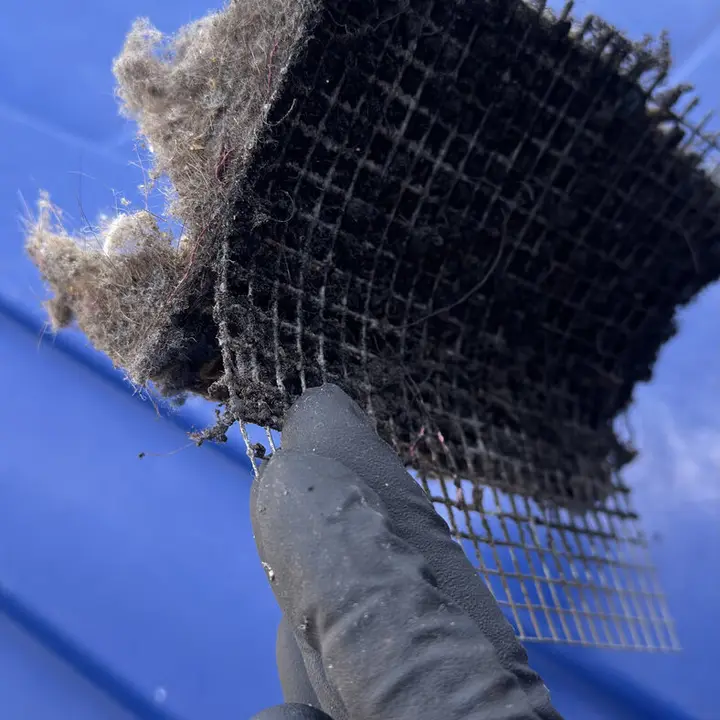 Vent screen packed with lint, Central Texas