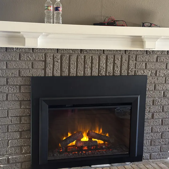 Gas insert in a brick fireplace, Central Texas