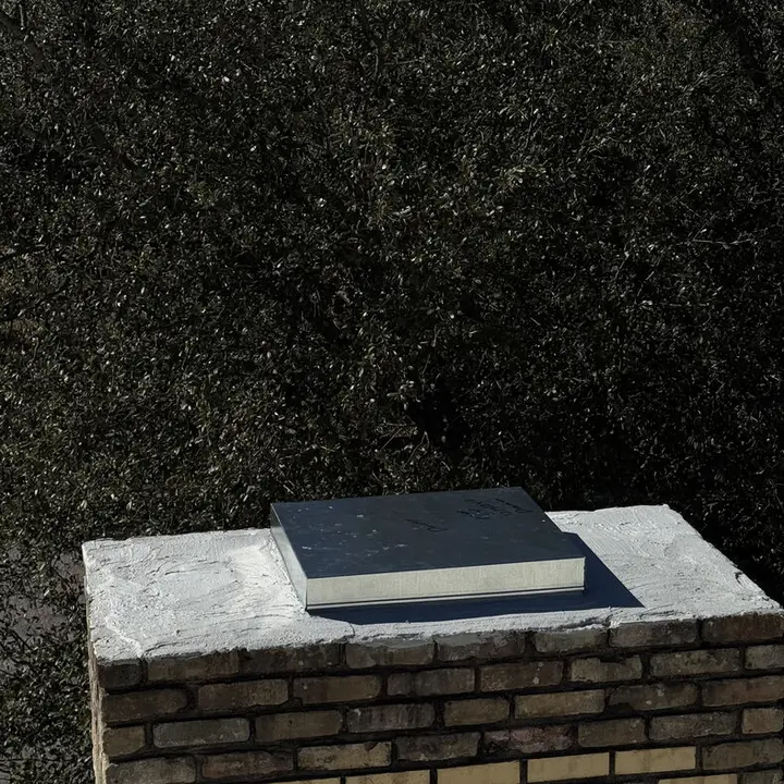Brick chimney with a new cap, Central Texas