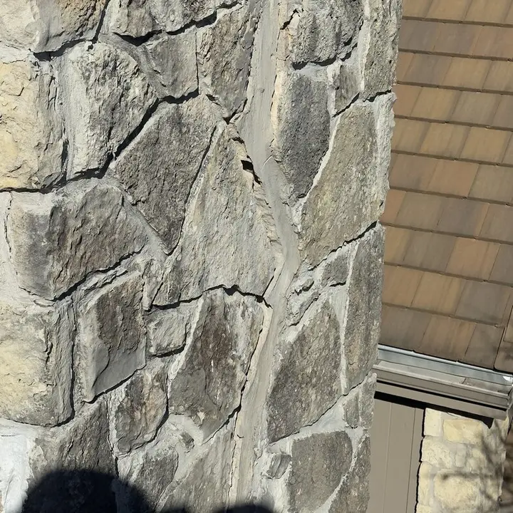 Cracked mortar joints on a stone chimney, Central Texas