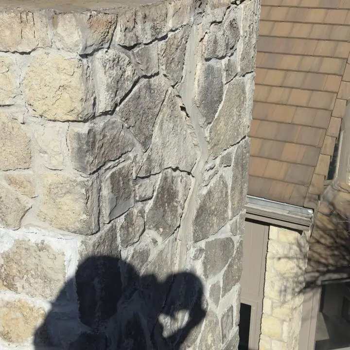 Cracked stone chimney from the roof, Central Texas